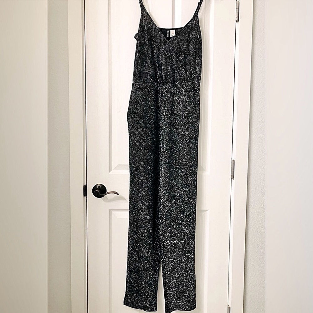 H&M black shimmer Romper. Size 8
Black & Silver